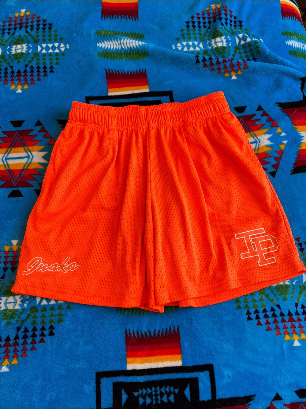 Inaka Women’s Athletic Shorts — Bright Orange